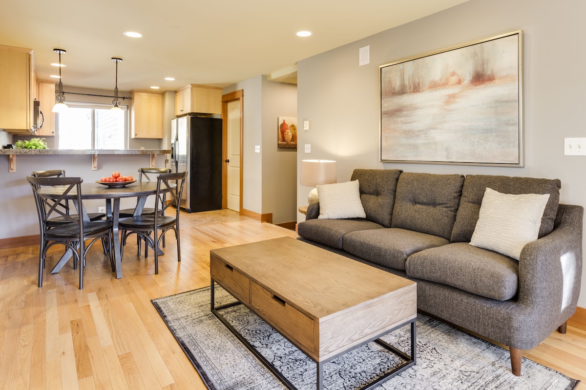 Stylish rental apartment living room with large area rug and modern decor