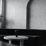 white black picture with sofa and round table
