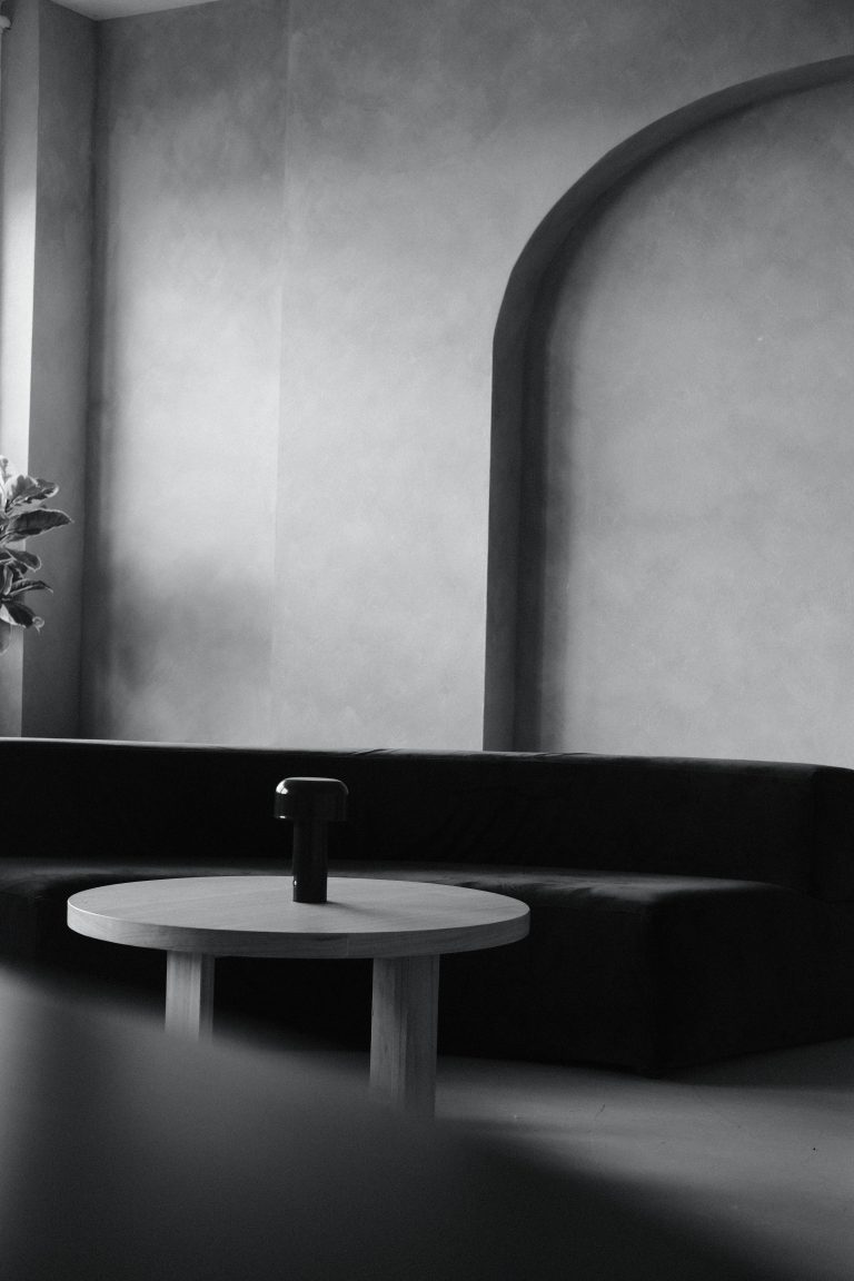white black picture with sofa and round table