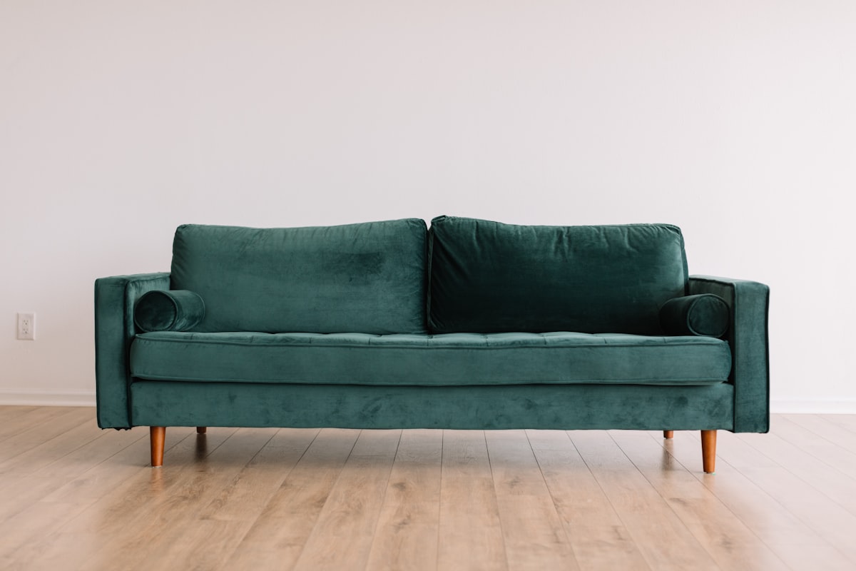 maximalist living room with bold velvet sofa and layered decor in 2026