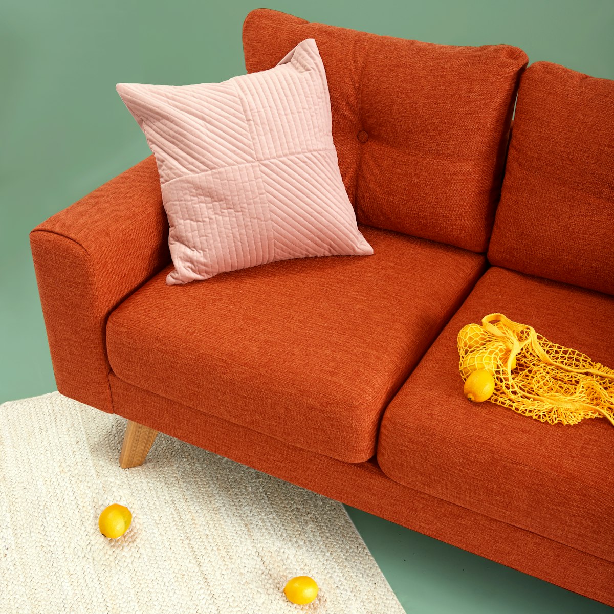 Rust tufted traditional sofa with throw blanket - English roll arm sofa style